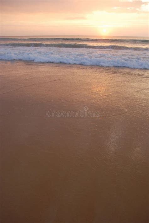 Sunset On The Smooth Sandy Beach With Gentle Waves Stock Image Image