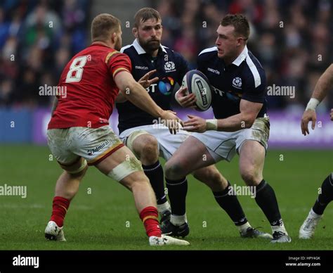 Scotlands Stuart Hogg Challenges Wales Ross Moriarty During The Rbs 6