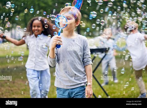 Kids Playing Bubbles Park Hi Res Stock Photography And Images Alamy