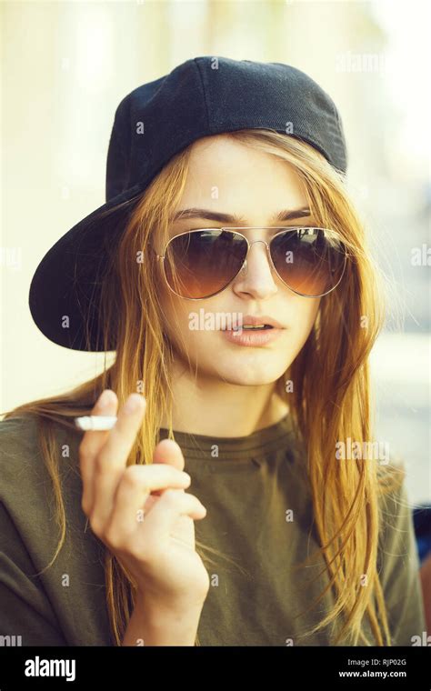 Pretty Young Girl Smoking Cigarette Stock Photo Alamy