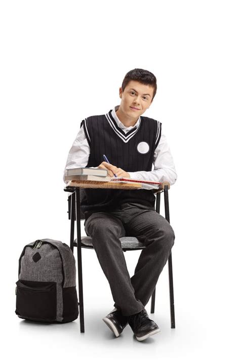 Teen Student Seated In A School Chair Taking Notes Stock Photo Image