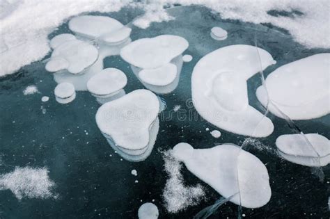 Gas Methane Bubbles Frozen In Blue Ice Of Lake Baikal Stock Photo