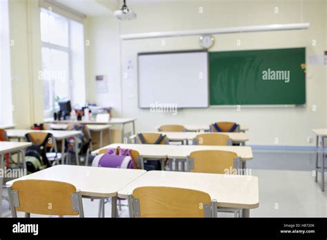 School Classroom With Desks And Blackboard Stock Photo Alamy