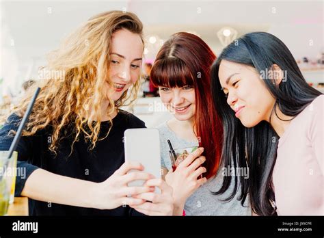 Three Young Girlfriends Taking Selfie Stock Photo Alamy