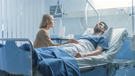 Wife Sitting Beside Her Husband S Hospital Bed Stock Image F033 3198 Science Photo Library