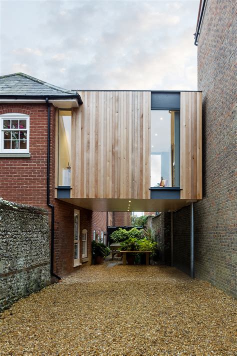 Do you have repairs you need to make on your asphalt driveway? Adam Knibb builds timber house extension above a driveway | Minimal Blogs