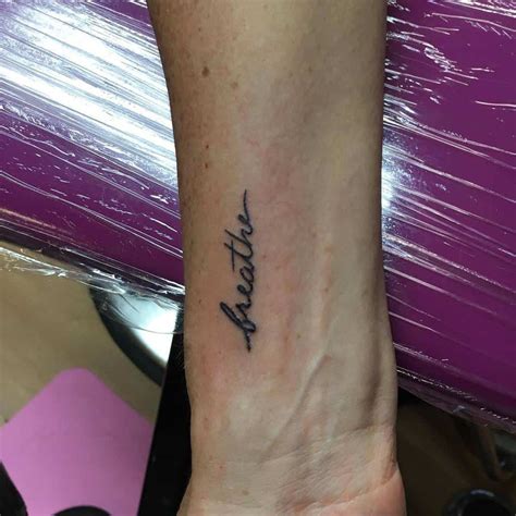 Stylish word tattoo on wrist. Top 71 Best Breathe Tattoos Ideas - 2021 Inspiration Guide