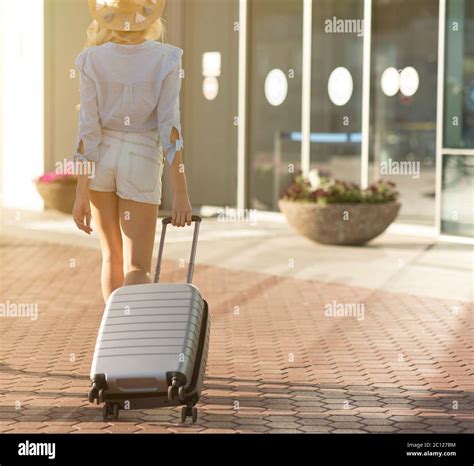 Tourist Walking With Baggage At Airport Terminal Stock Photo Alamy