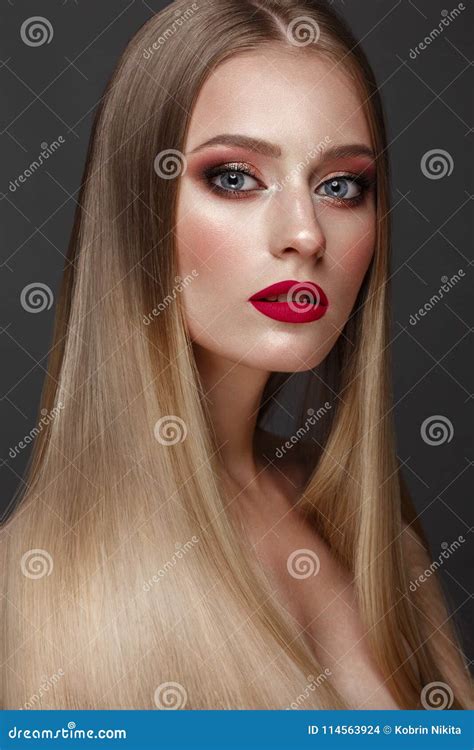 Beautiful Blond Girl With A Perfectly Smooth Hair Classic Make Up And