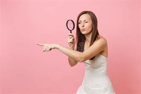 Concerned Dissatisfied Bride Woman In Wedding Dress Pointing Index