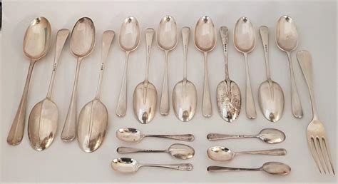 A Large Collection Of Silver Flatware To Include Four Silver Rat Tail Pattern Table Spoons