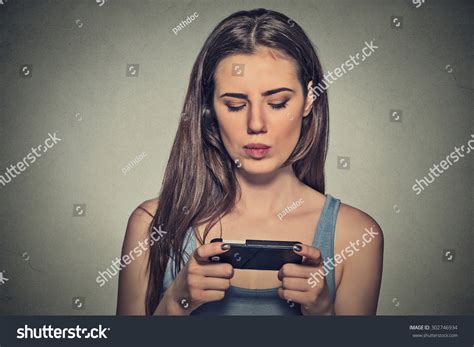 Portrait Young Angry Woman Unhappy Annoyed By Something Someone On Her Cell Phone Texting