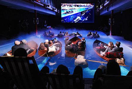 After a long search for a spot to set up camp, the father finds a perfect place overlooking a pool. Movie night on the big screen lounging in boats in a pool ...