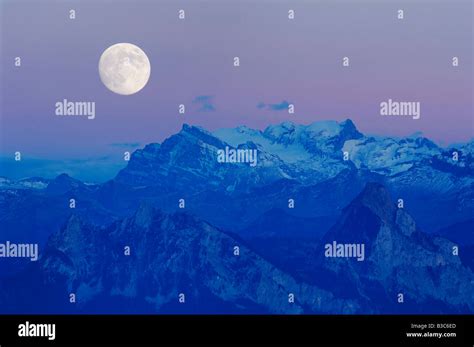 Swiss Alps And Full Moon Schwyz Switzerland Stock Photo Alamy