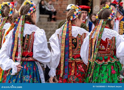 Traditional Polish Folk Costumes On Parade In Krakow Main Market Square