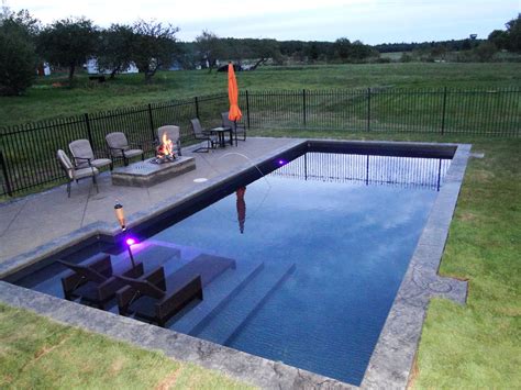 Simple Rectangular Pool With Pool Furniture And Fireplace Inground