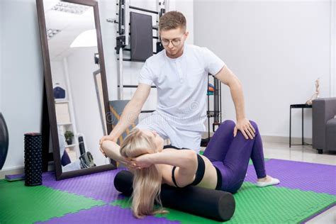 Sports Massage Osteopath Therapist Working With Legs Muscle Athlete Woman After Workout Stock