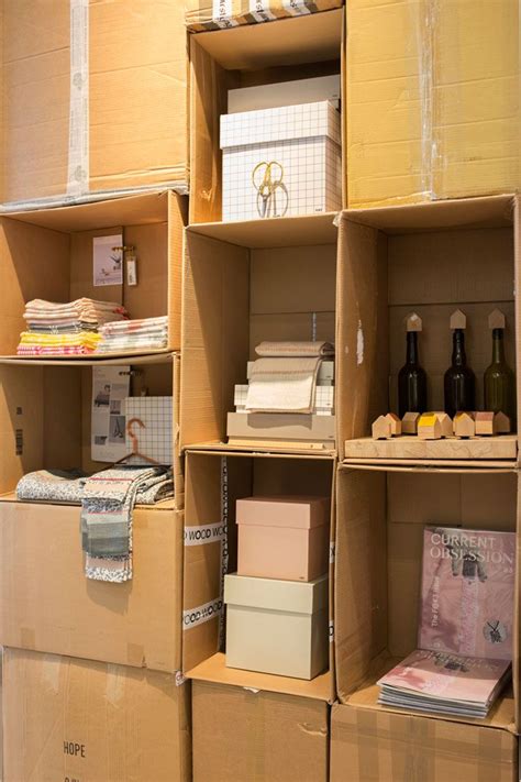 Great idea to use cardboard boxes as shelving for a pop-up ...