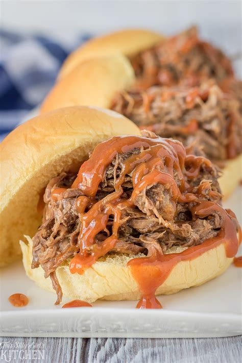 Pour the stock around the beef. Slow Cooker BBQ Beef Sliders - This Silly Girl's Kitchen