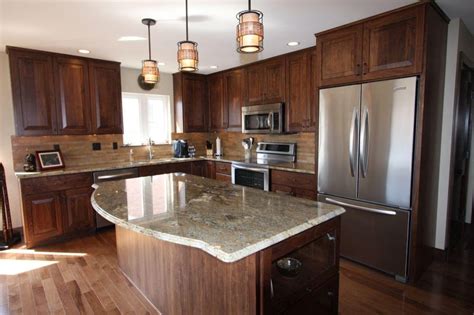Choose from more than 1,100 wood and paint finishes. Earth-tone kitchen remodeled with Walnut cabinetry ...