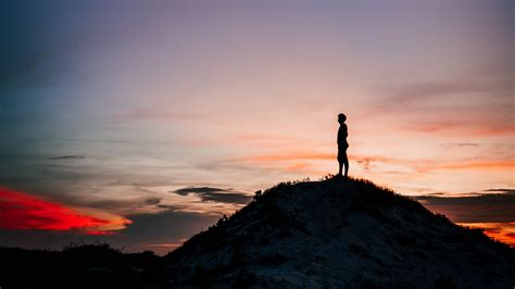Man Is Standing Alone On Rock Sand In Silhouette Background 4k Hd Alone