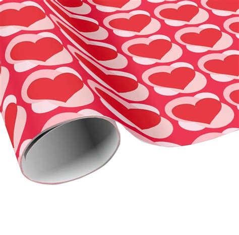 A Red And White Wrapping Paper With Hearts On The Front As Well As An