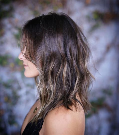 It is characterized by higher levels of the dark pigment eumelanin and lower levels of the pale pigment pheomelanin. Dark-Ash-Brown Wavy Hair with Layers and Super-Subtle ...