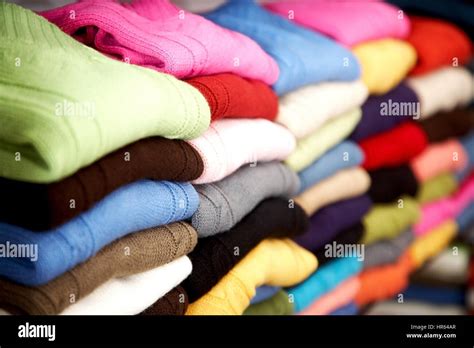 Colourful Clothes Stacked In A Retail Store Woolen Jumpers Stock
