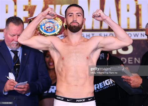 Sandor Martin Flexes On The Scale During The Weigh In Ahead Of His