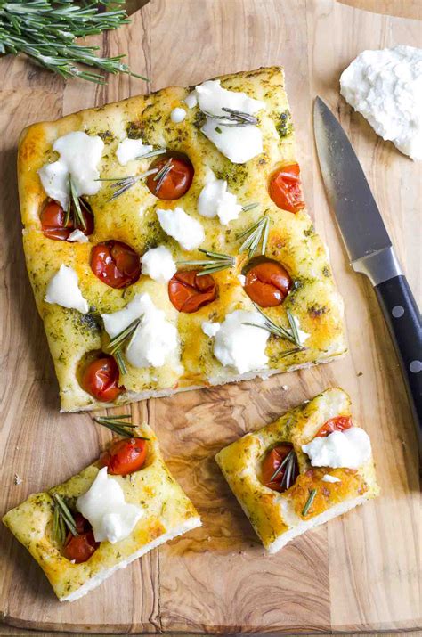 Soft and spongy inside it's generously coated with extra virgin olive oil and large coarse sea salt that creates the perfect crust. Focaccia Bread Recipe With Cherry Tomatoes, Basil Pesto ...