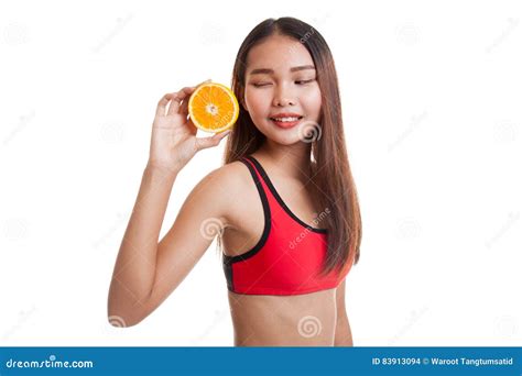 Азиатская здоровая девушка на диете с оранжевым плодоовощ Стоковое Фото