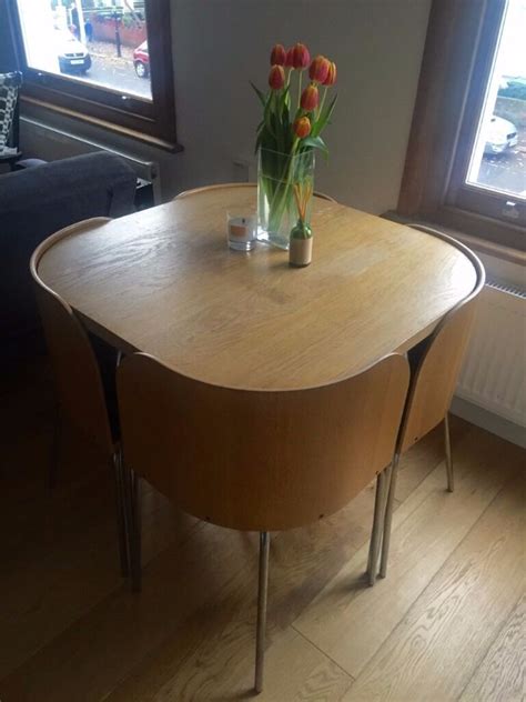 Wrapped coffee table with 3 chairs and 3 cushions form a wooden ball and have to be unwrapped before use. Discontinued ikea fusion space saving compact table with 4 ...