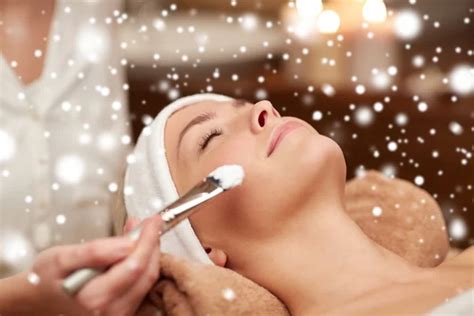 Woman Face And Beautician Applying Mask In Spa Stock Image Everypixel
