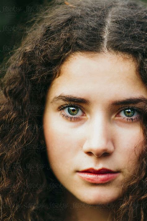 Extreme Close Up Of Beautiful Baby Faced Curly Woman By Stocksy