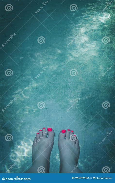 Womans Feet In Swimming Pool Of Bright Turquoise Blue Water Stock Photo Image Of Relaxation