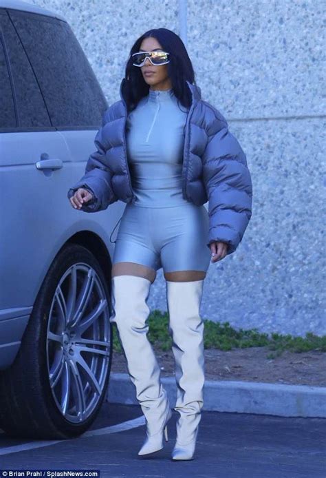 kim kardashian shines in silver thigh high boots and clinging bodysuit kim kardashian outfits