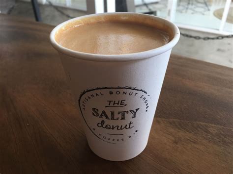 A Cup Filled With A Cinnamon Toast Crunch Latte At The Salty Donut In