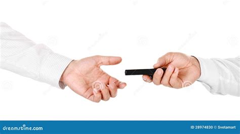 Male Hand Holding A Mobile Phone And Handing It Over To Another Stock