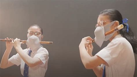 Hong Kong Covid Double Masked Flautists In Ad Spark Ridicule Bbc News