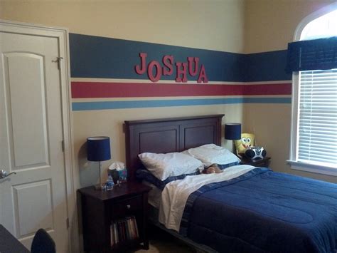By painting the space above the white trim a bold black the room is instantly updated. Eat. Sleep. Decorate.: Striped Walls-Boys Bedroom FINISHED!