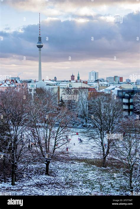 Berlin Skyline With Tv Tower And Snow Covered Trees In Weinberg Park
