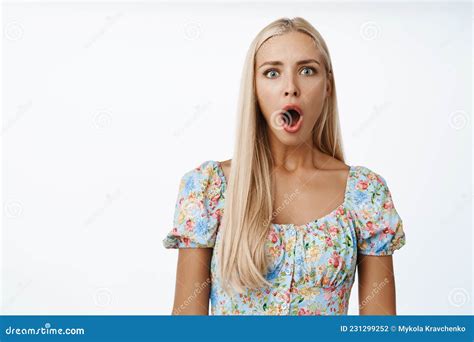 Portrait Of Shocked Blond Woman Drop Jaw And Gasping Staring Startled