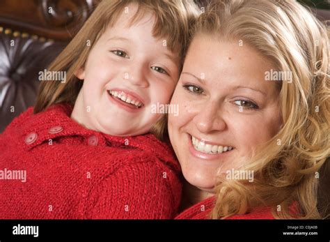 Beautiful Blonde Mother And Daughter Enjoying A Personal Moment Stock