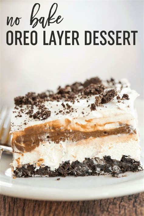 Layered oreo pudding dessertseeded at the table. An easy no bake dessert with layers of Oreo crust, cream ...