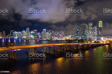 Aerial Photo Downtown Miami At Night Bridges Over Water Leading To The