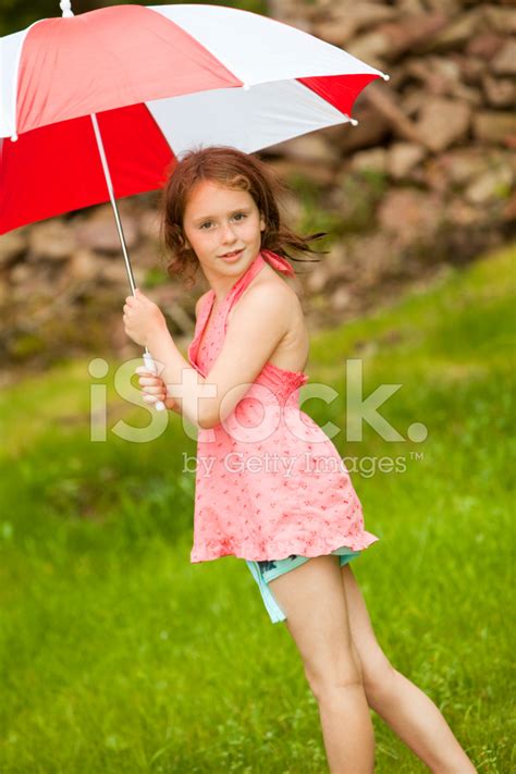 Little Girl With Umbrella In The Sunny Day Stock Photos