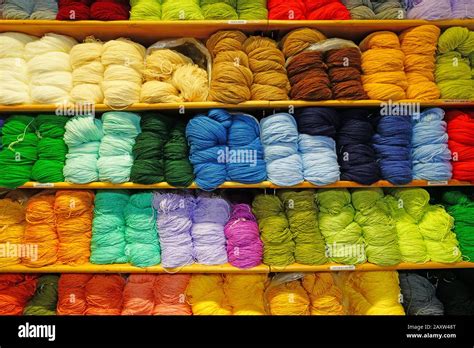 Shelves Filled With Colorful Wool Yarn Spools In A Knitting Store Stock