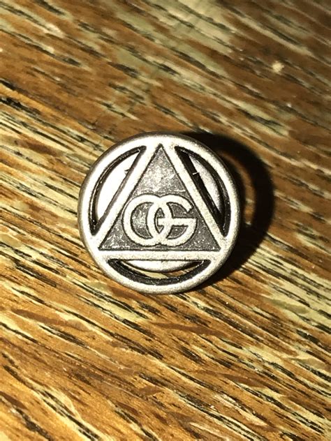 Metal Pin Found At Friends House Og Inside Of A Triangle Inside Of A