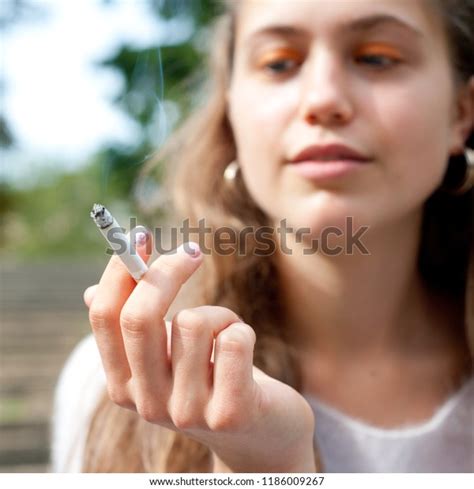 Photo De Stock Young Pretty Girl Smoking Cigarette 1186009267