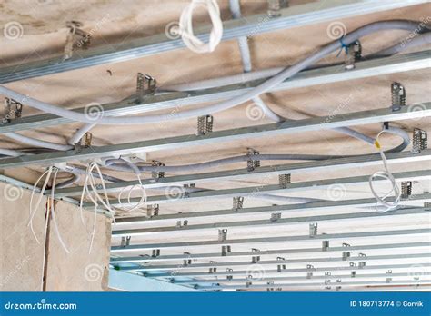 Electrical Wiring On The Concrete Ceiling In Drywall Stock Photo